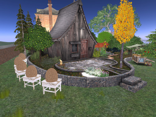 A Second Life home with trees, beehives, and a charming fantasy cottage