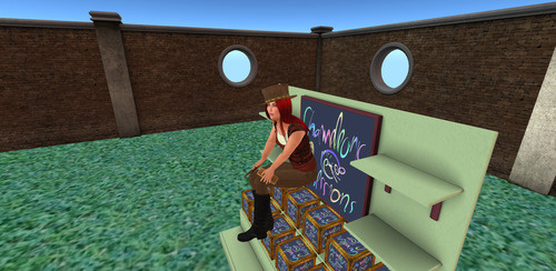 Second Life avatar sitting on a market stall stacked with empty inventory boxes